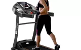 A women is doing exercise on treadmill